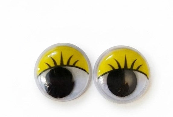Hobi masasında sergilenen 15mm sarı, kirpikli oynar gözler